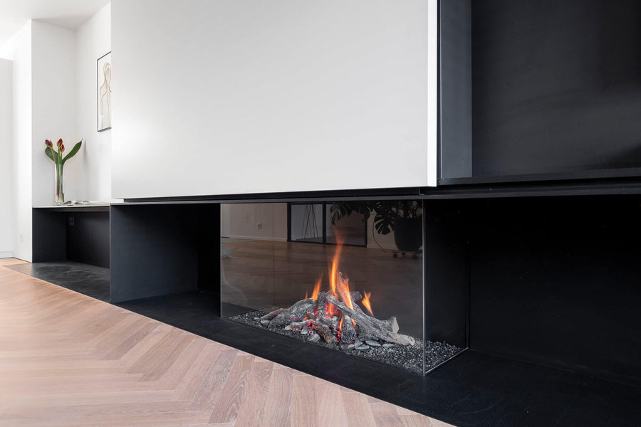 Living room with white oak herringbone flooring and a fireplace.
