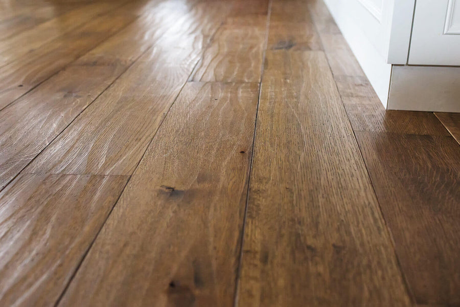 Detail shot of hand scraped white oak floor finished with hardwax oil.
