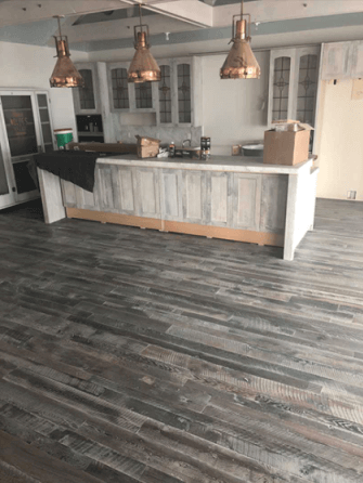 Fumed hardwood skip and miss oak flooring with white oil finish on it.
