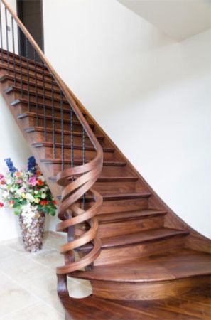 Walnut staircase hand rails finished with Rubio Monocoat's hardwax oil wood finish.