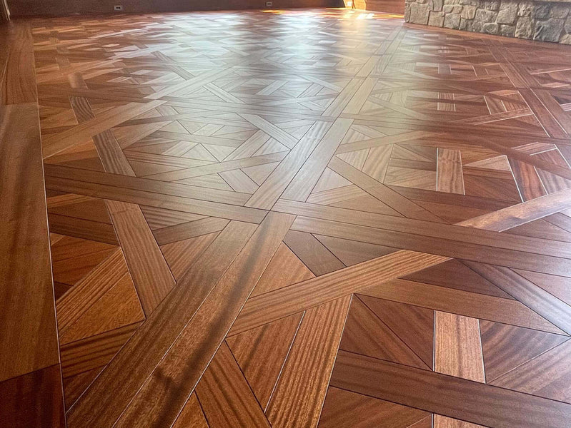 A closer look at the Bordeaux parquet sapele hardwood flooring finished with a durable oil wood finish.