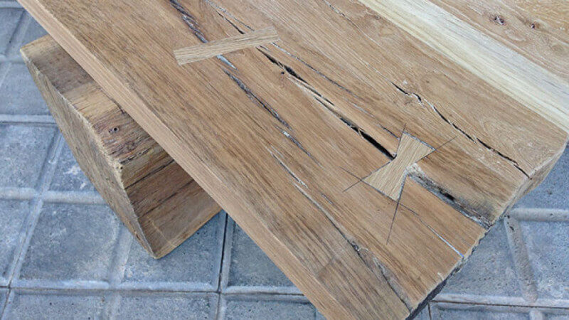 An oak bench with bow-ties finished using a plant-based wood finishing oil.