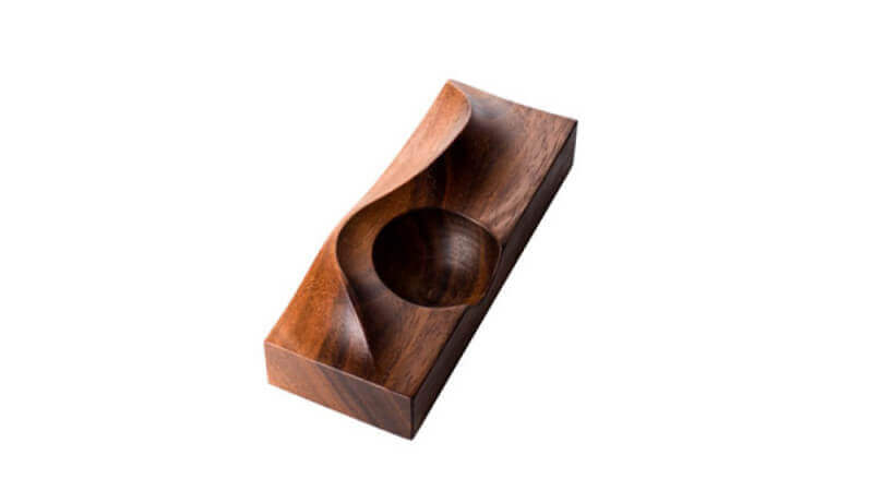 A walnut wood egg serving tray.