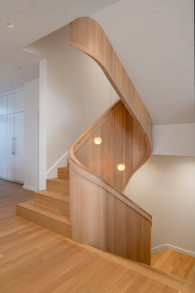 Rift sawn white oak staircase finished with a natural oil wood finish.