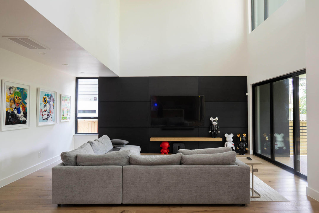 An paned out image of the black accented Chippendale living room.