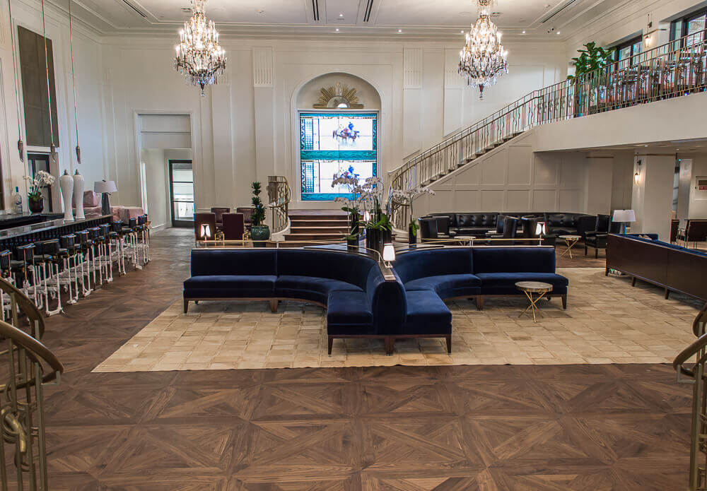 Parquet flooring made out of walnut wood and finished with a matte wood finish.