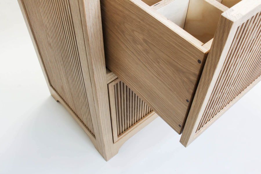 A view looking at a downward angle on a handmade storage dresser. The drawers are pinned with walnut dowels. The dresser is white oak and is finished with Rubio Monocoat Oil Plus 2C hardwax oil finish.