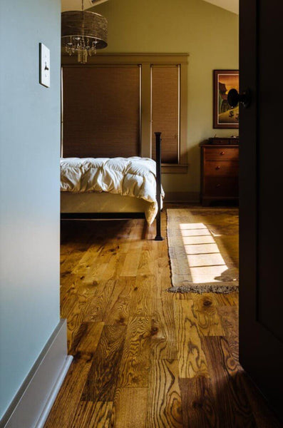Bedroom boasts red oak hardwood floors finished with Rubio Monocoat.