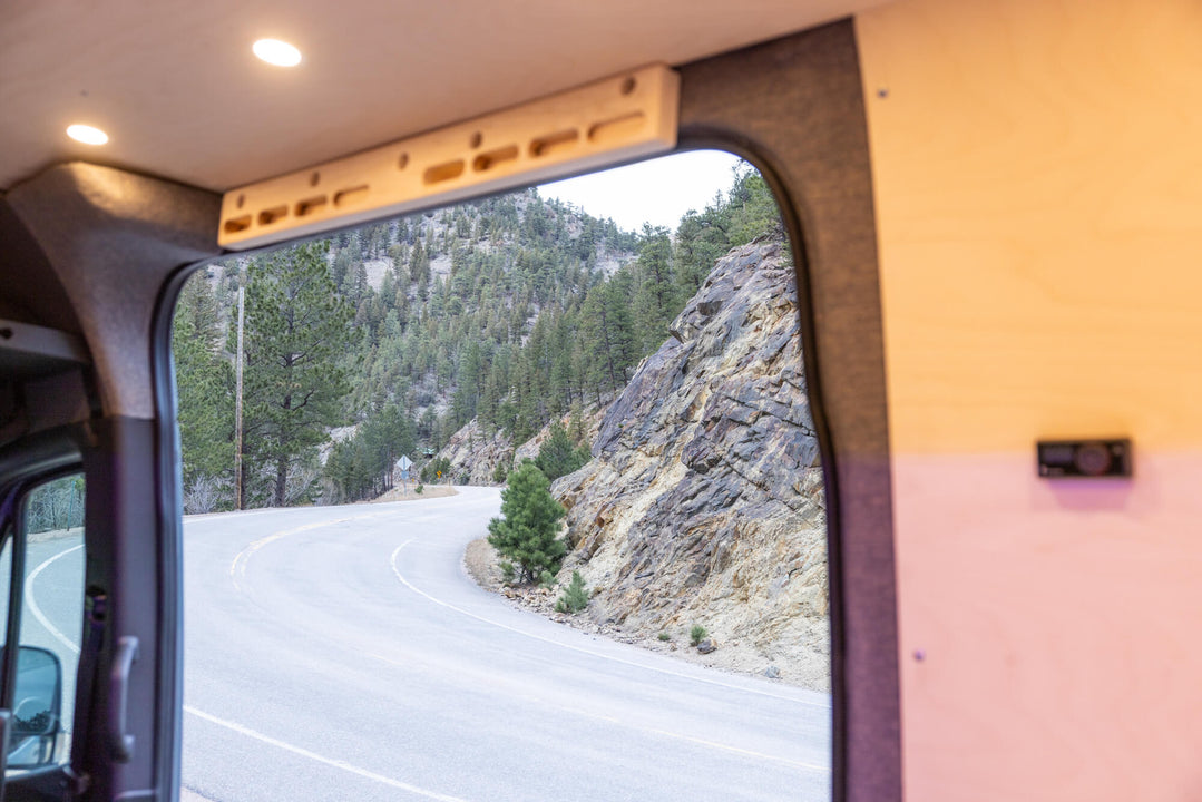 Mountainous terrain outside of a camper van.