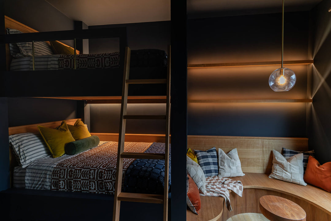 Built in bunk beds made accented with brass and cherry wood finished with Rubio Monocoat "Pure".