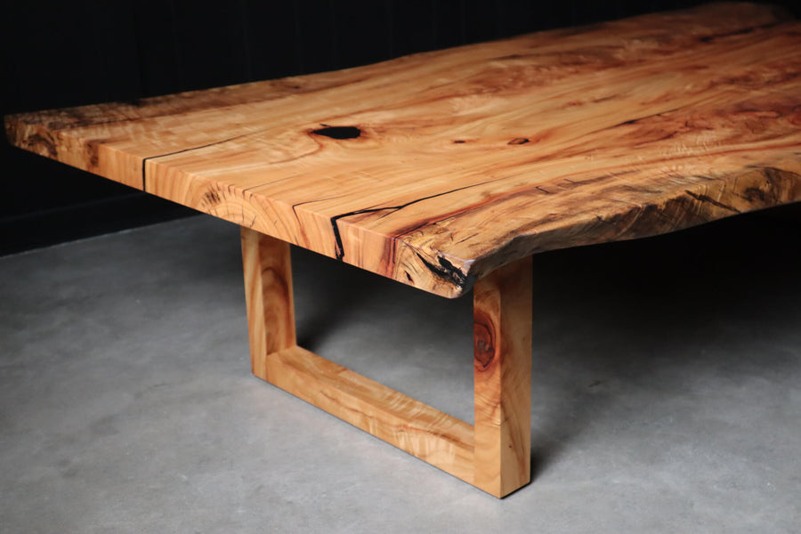 A live edge coffee table made from camphor wood finished with Rubio Monocoat Oil Plus 2 C Pure.