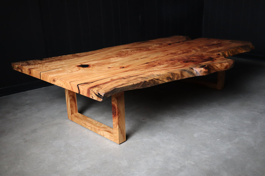 Camphor slab coffee table with a modern base and hardwax oil finish.