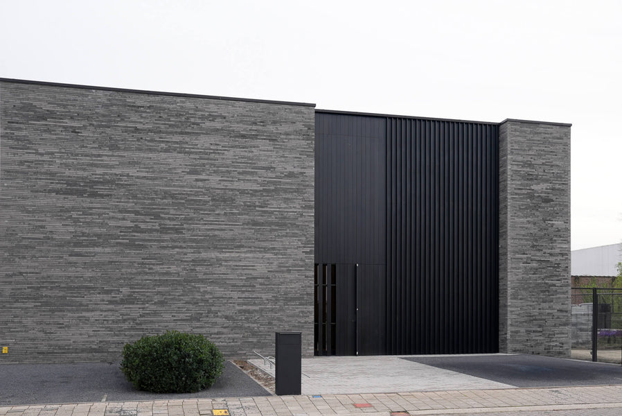 Fraké wood cladding finished with DuroGrit "Saddle Black" for a clean, modern look.