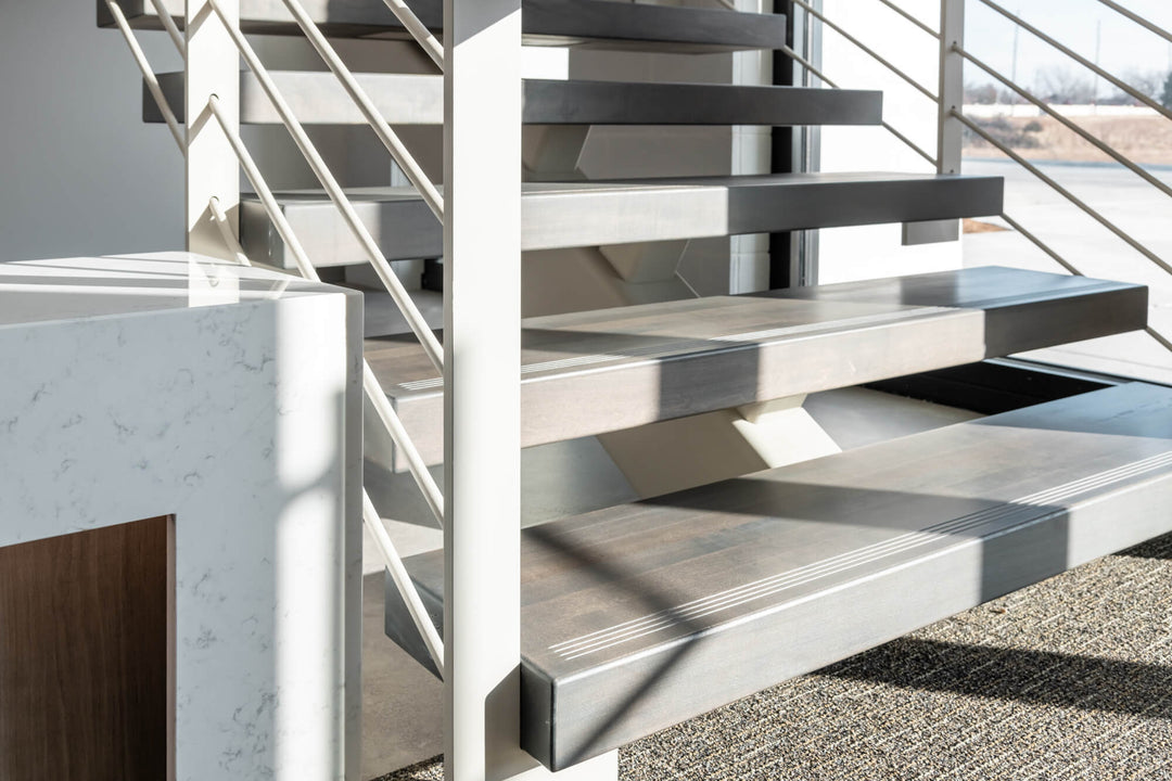 Maple stair treads finished with Rubio Monocoat Precolor Easy and Oil Plus 2C for a grey look.