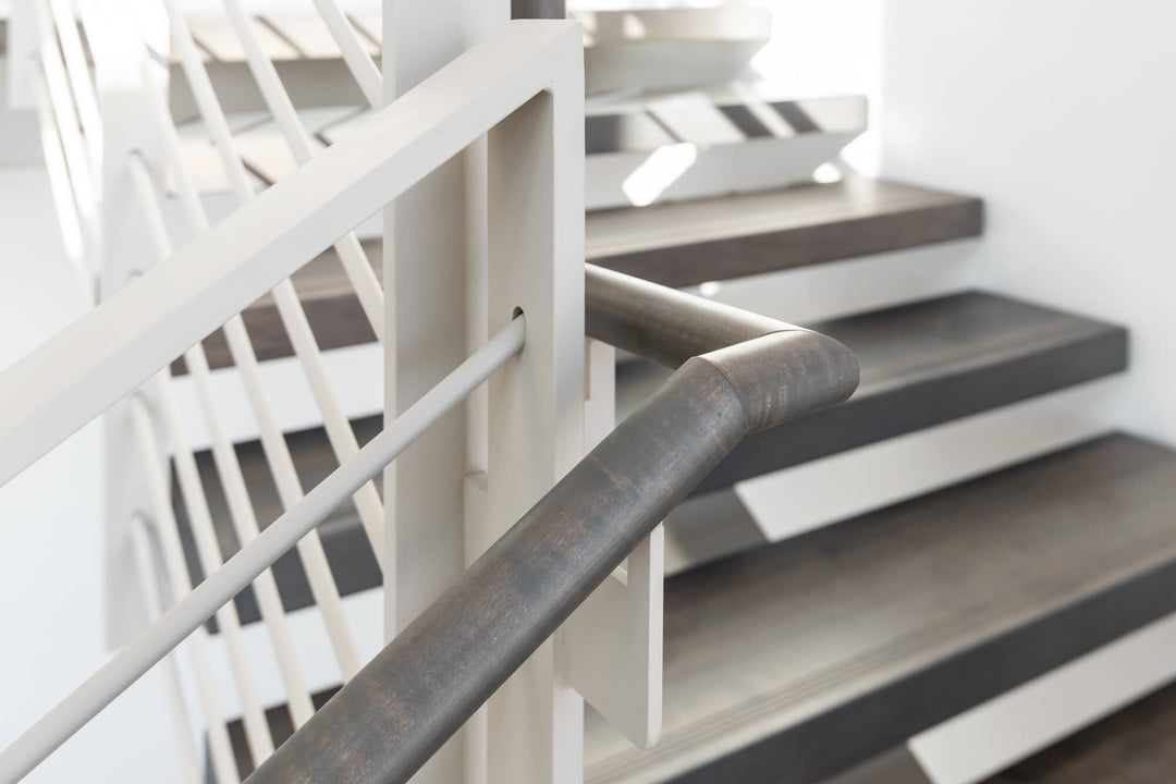 Custom maple handrail finished with Rubio Monocoat Precolor Easy and Oil Plus 2C.