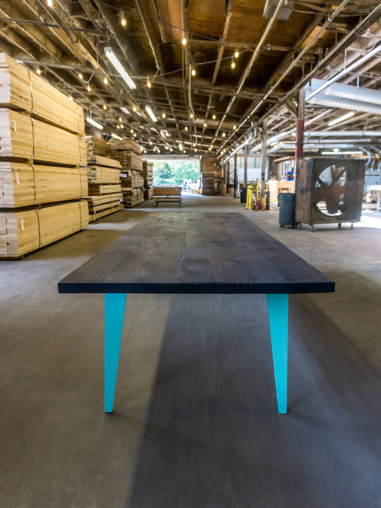 A white oak dining table that was charred and finished with Rubio Monocoat Oil Plus 2C "Pure".