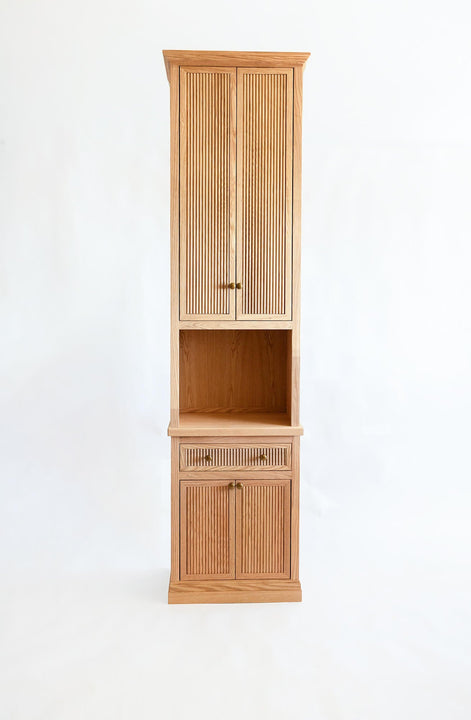 A red oak book case with several storage areas finished with Rubio Monocoat Oil Plus 2C Dunes.