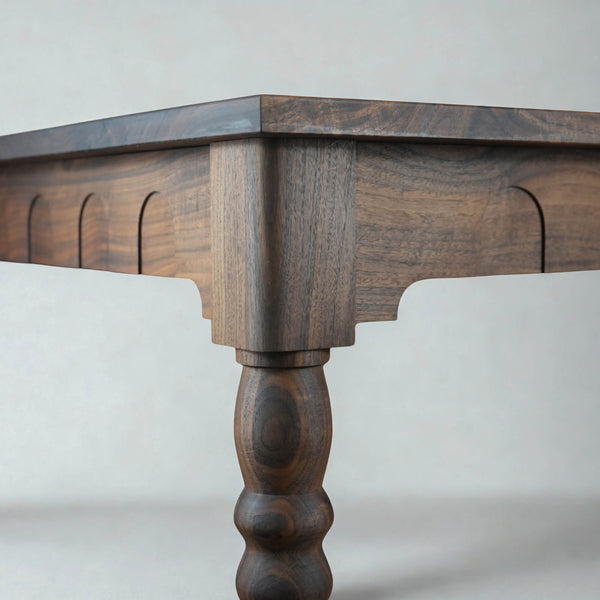 Walnut dining table with arched apron detail finished with Rubio Monocoat Oil Plus 2C hardwax oil wood finish.