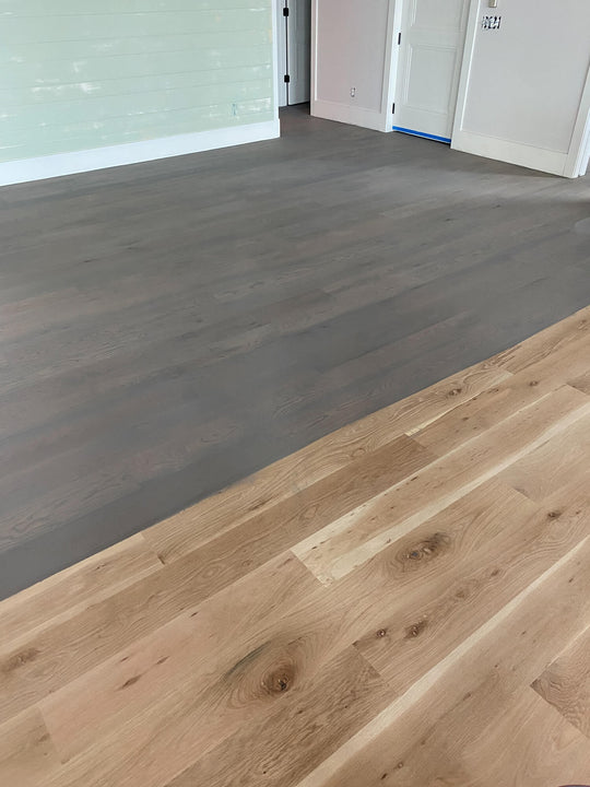 The start of a white oak floor being finished with Precolor Easy "Urban Grey".