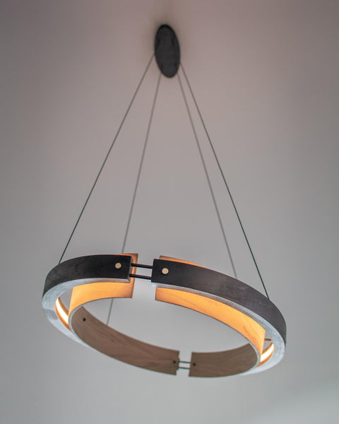 A two-toned wood light fixture made from oak wood and finished using Rubio Monocoat products.