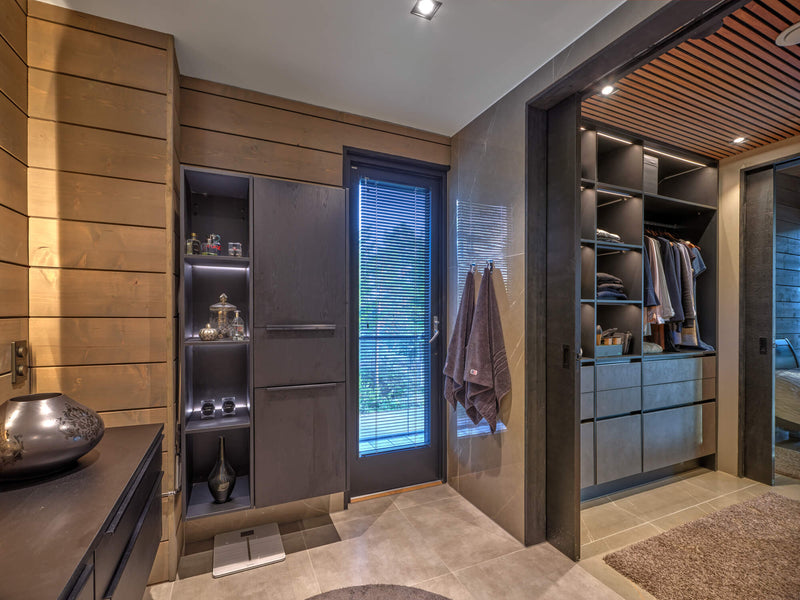 A bathroom and closet inside a modern lodge-style home with spruce cladding finished and protected with Rubio Monocoat products.