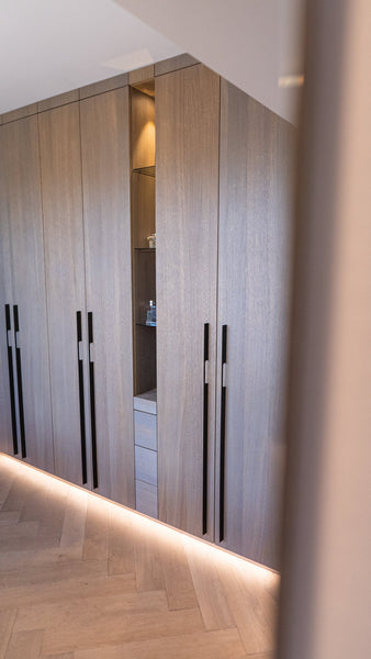 Oak veneered closet doors finished with a hardwax oil wood finish.