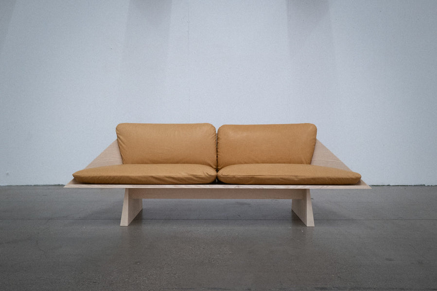 Ash sofa finished with Rubio Monocoat Oil Plus 2C with brown leather cushions.