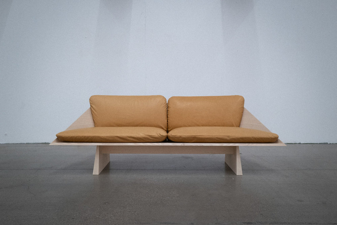 Ash sofa finished with Rubio Monocoat Oil Plus 2C with brown leather cushions.