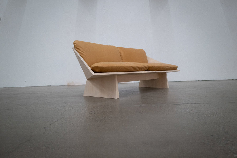 A geometric sofa made from ash finished with Rubio Monocoat Oil Plus 2C hardwax oil wood stain and finish.