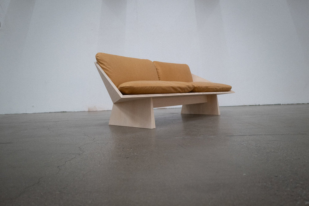 A geometric sofa made from ash finished with Rubio Monocoat Oil Plus 2C hardwax oil wood stain and finish.