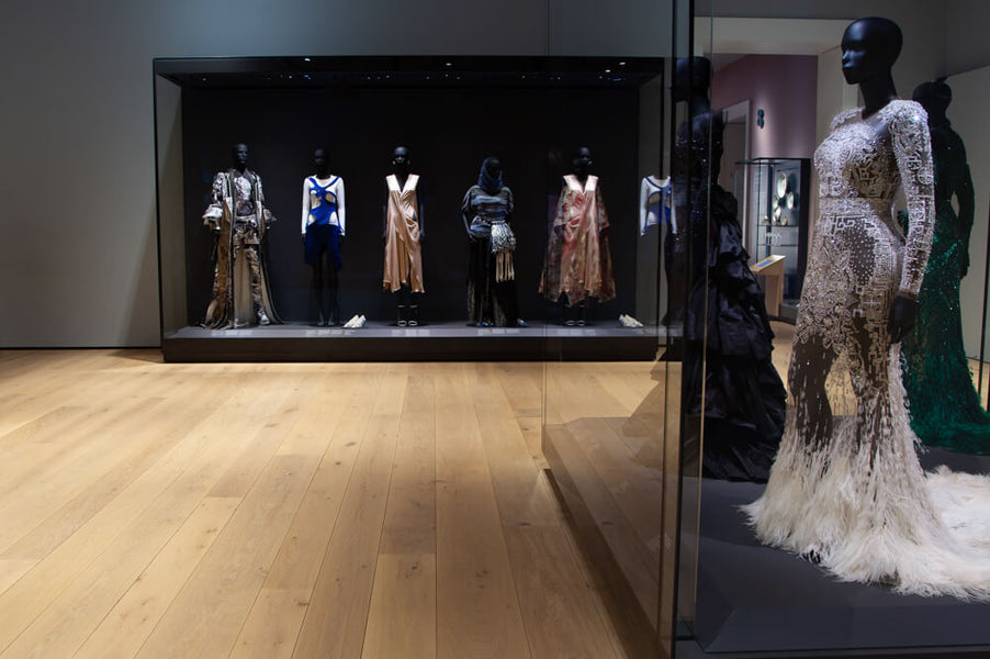 Several dresses on display mannequins at the Norwegian National Museum.