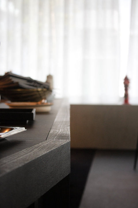 A close up of the oak trim that was treated with an opaque black wood finish.