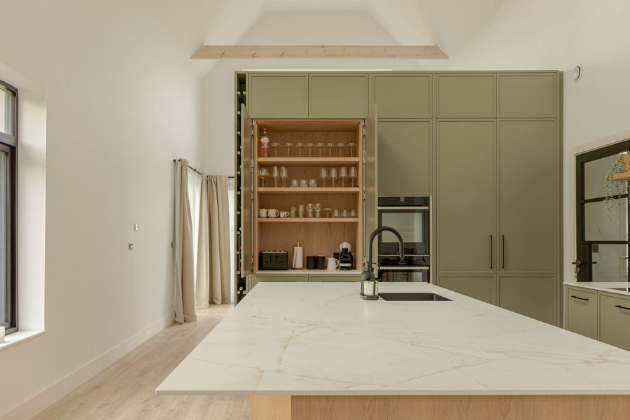 A light and airy kitchen with a large amount of cabinetry. The oak details in this space were finished with Rubio Monocoat Oil Plus 2C "Smoke " a light and natural single layer wood stain and finish.