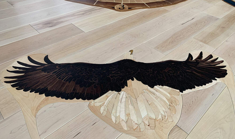 Detail shot of a wood inlaid bald eagle finished with a hardwax oil wood finish.