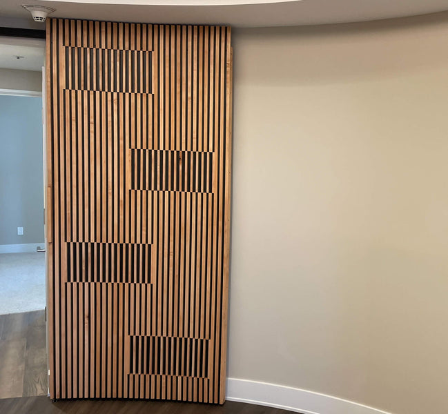 A modern slatted wood door finished with Rubio Monocoat Oil Plus 2C.