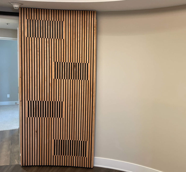 A modern slatted wood door finished with Rubio Monocoat Oil Plus 2C.