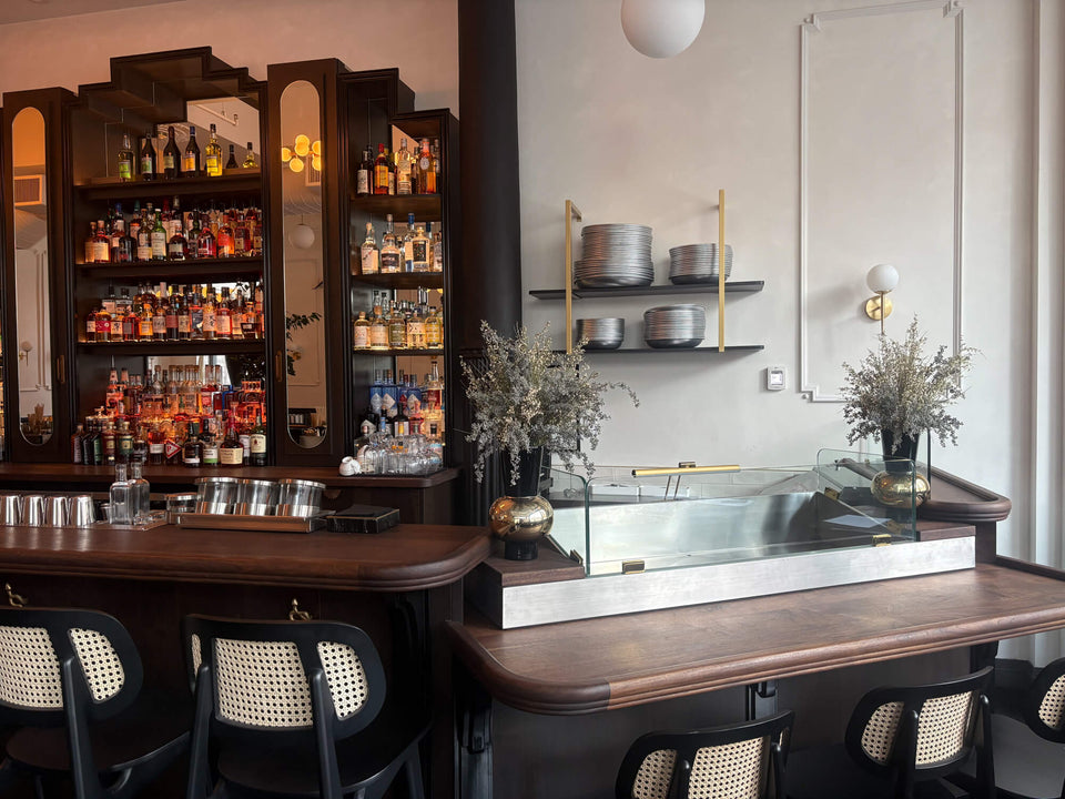 A large walnut bar top at a seafood restaurant, colored and protected using Rubio Monocoat Oil Plus 2C hardwax oil wood stain and finish.