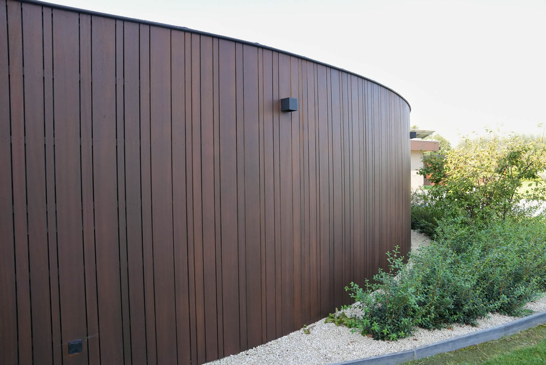 Thermally modified wood fencing finished with DuroGrit, an extremely durable exterior wood stain and finish in one.