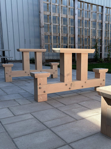 Timberframe bases for a large outdoor patio table durably finished using Rubio Monocoat DuroGrit exterior wood stain and finish.