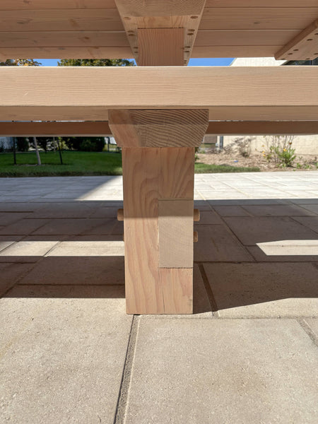 Joinery on a 16 foot long outdoor table finished using DuroGrit Light Sand.