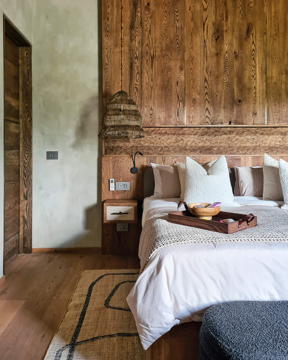 A modern safari-inspired bedroom featuring European Oak millwork finished with Rubio Monocoat Oil Plus 2C "Black".