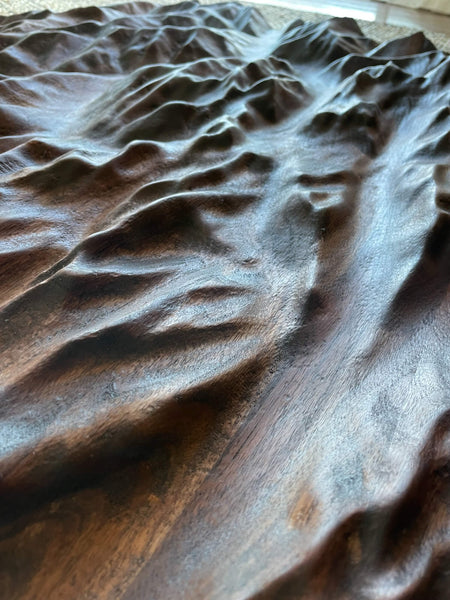 A walnut topographic map detail shot finished with Rubio Monocoat Oil Plus 2C.