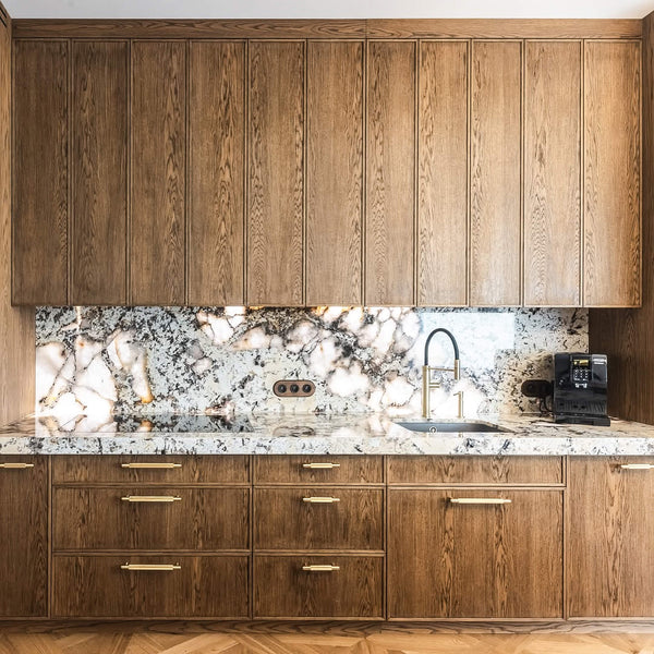 Organic modern kitchen with rich brown oak cabinetry finished with Rubio Monocoat Oil Plus 2C hardwax oil wood stain and finish.