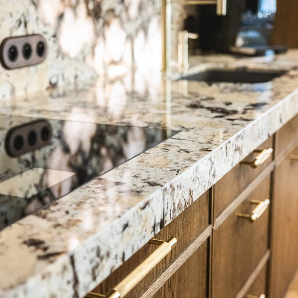 Patagonian stone countertops in a minimalist kitchen with oak cabinetry finished with Rubio Monocoat Oil Plus 2C hardwax oil wood stain and finish.