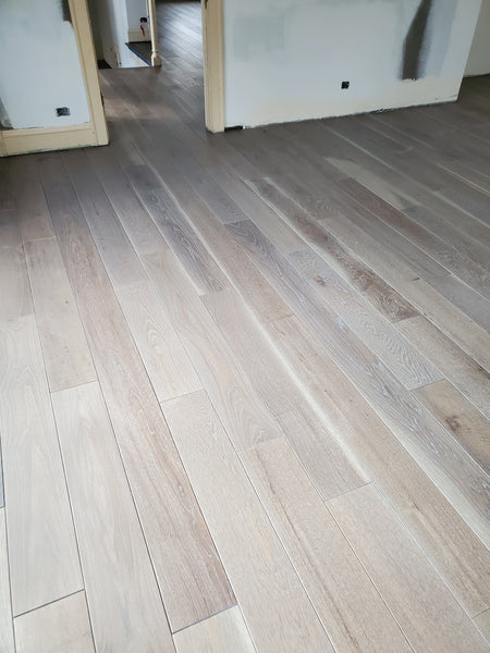 Light colored cerused wood flooring finished with Rubio Monocoat products.