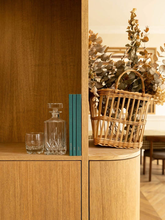 Close-up of white oak shelving finished with Rubio Monocoat Oil Plus 2C Pure, natural wood grain with decanter and dried florals