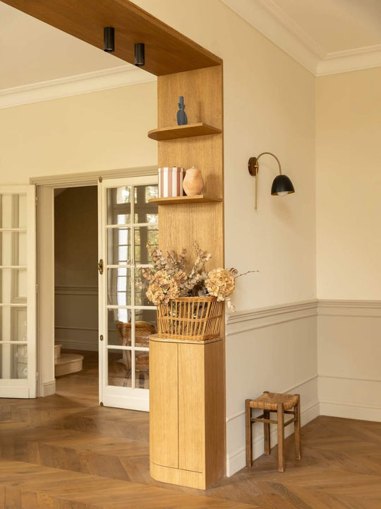 Rounded oak room divider column finished in Rubio Monocoat Oil Plus 2C Pure, floating shelves in open-concept living space