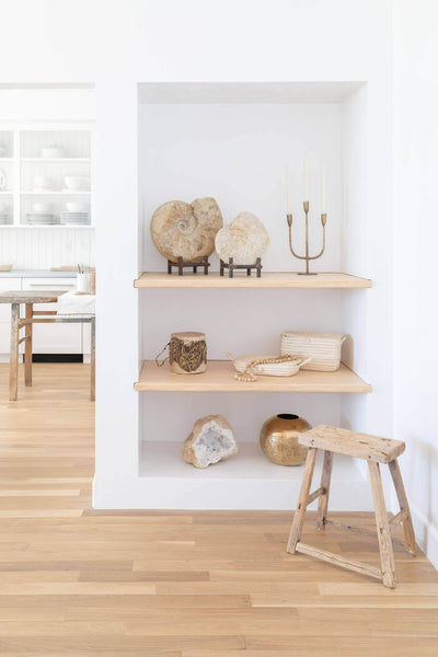 Built in living room shelving with natural hardwood flooring