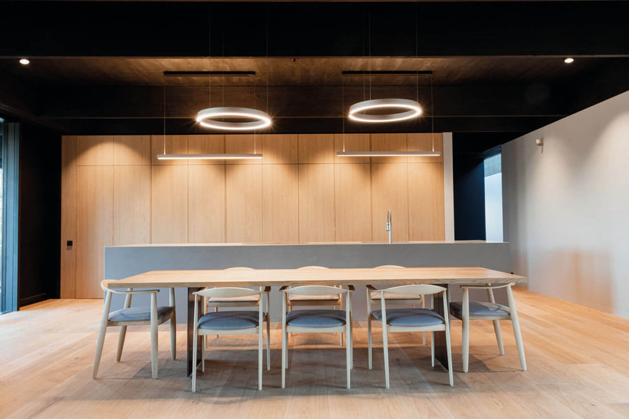 Interior dining room of modern residential house features wood finished with Rubio Monocoat.