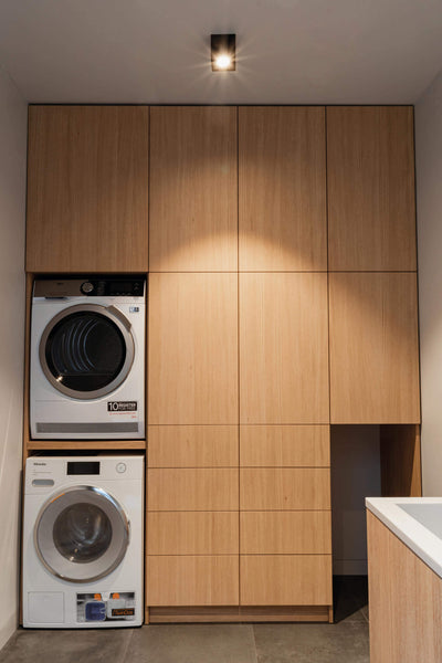 Laundry room with oak cupboards finished with Rubio Monocoat Oil Plus 2C.